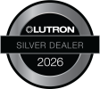 Circular metallic badge with a black center and horizontal bar
